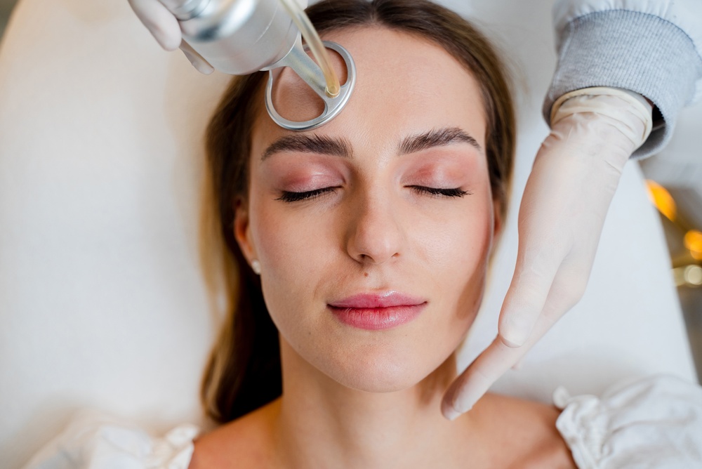 A patient undergoes laser skin rejuvenation with a CO2 laser skin resurfacing treatment